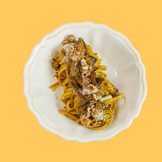 Linguina con porcini, zafferano, fonduta di Gorgonzola e nocciole