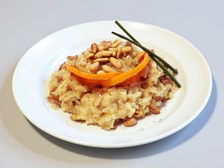 Risotto con anatra, arancia e pinoli tostati