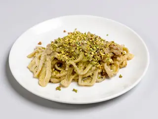 Tagliolini con Pesto di Pistacchio e Guanciale di Suino Nero dei Nebrodi 