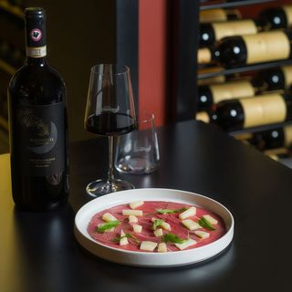 Carpaccio di Black Angus affumicato con parmigiano vacche rosse