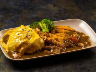 Riso al curry con cotoletta di maiale