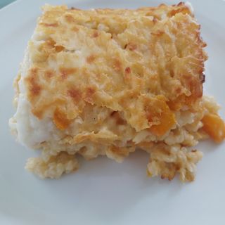 Timballo di riso alla zucca con speck, formaggio e besciamella