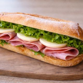 Ciabattina prosciutto cotto, scamorza e insalata verde