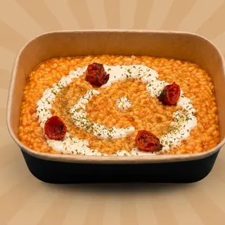 Risotto con pomodorini arrosto, stracciatella e origano fresco