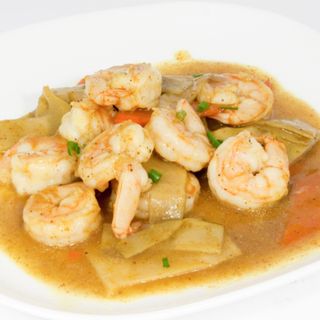 Gamberi saltati con verdure e curry