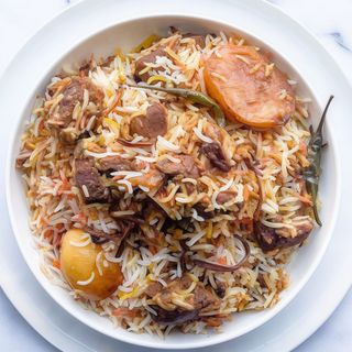 Mutton Biryani (Served with rice and chilli paste)