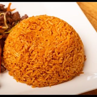 Jollof Supreme Combo – Chicken/Beef Jollof Rice paired with a Soda