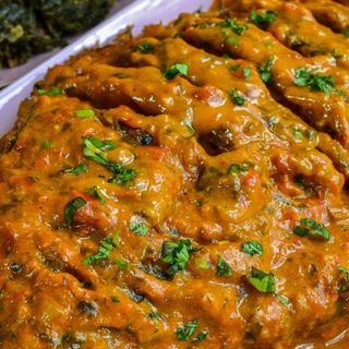 Large Tilapia in coconut sauce.