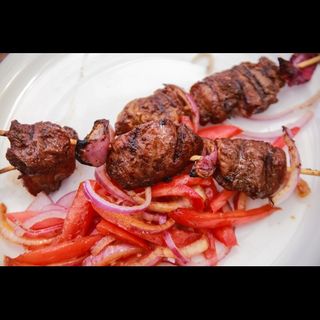 Mshikaki Flame-Chicken/Beef mshikaki paired with a Soda