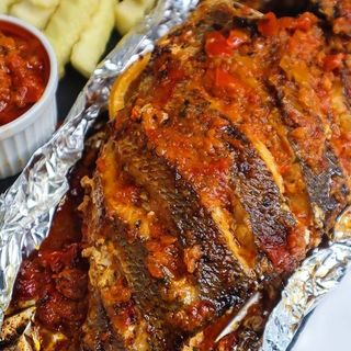 Wet fry tilapia with fries and kachumbari.
