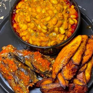 Oloyin beans served with tilapia fish and plantains