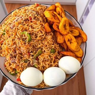 Noodles served with plantains and 3 boiled eggs