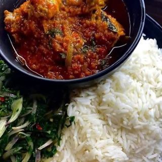 White rice served with titus fish and eforiro vegetables