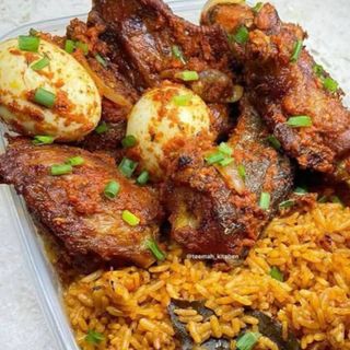 Jollof rice, 2 boiled eggs in beef stew