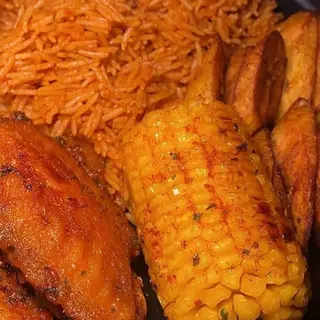 Jollof rice, plantains, chicken mixed with boiled sweetcorn