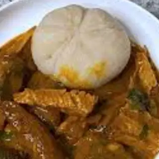 Ogbono mixed with Assorted meat served with white eba