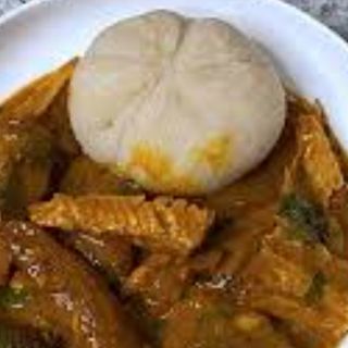 Ogbono mixed with Assorted meat served with white eba