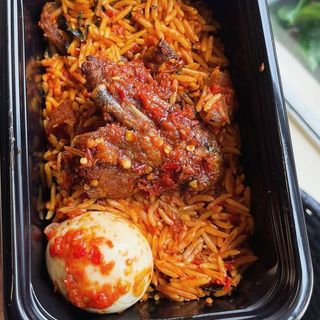 Jollof rice, 1 piece peppered chicken and boiled egg