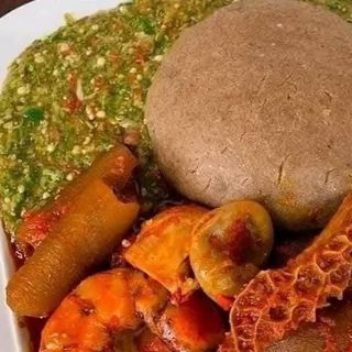 Amala served with okro mixed with beef, shaki and pomo