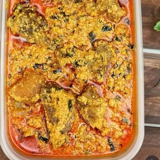 Egusi mixed with pomo and nile perch fish 