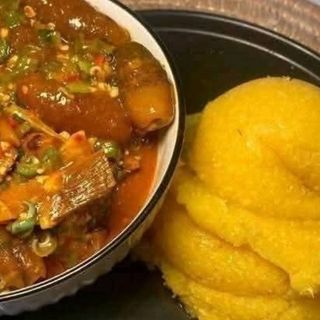 Yellow Eba served with okro mixed with beef and pomo