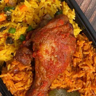 Half Jollof, Half fried rice with peppered turkey drumstick and a can of Palm Wine