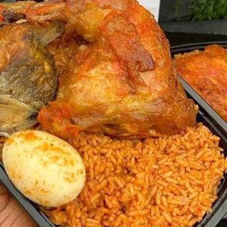 Jollof rice, chicken, titus and 1 boiled egg 