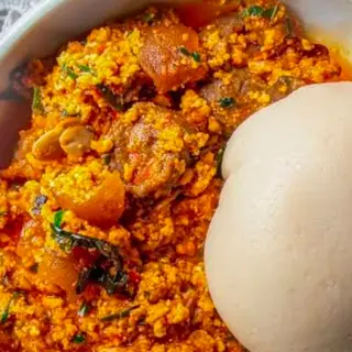 Fufu served with egusi mixed with pomo