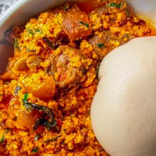 Fufu served with egusi mixed with pomo