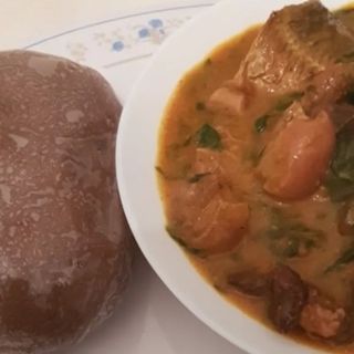 Ogbono mixed with Assorted meat served with Amala 