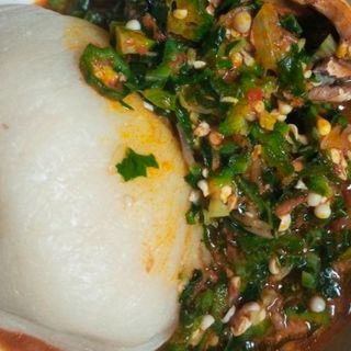Fufu served with okro mixed with assorted meat