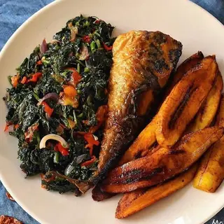 Eforiro vegetables, fried titus fish and fried plantains