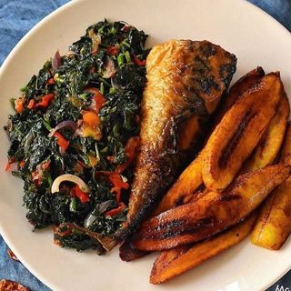 Eforiro vegetables, fried titus fish and fried plantains 
