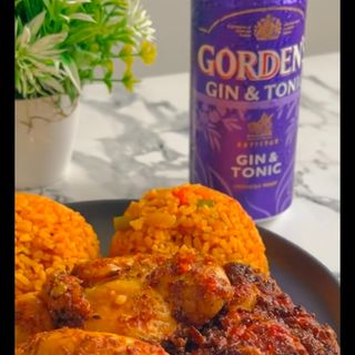Jollof rice, chicken and purple Gin tonic