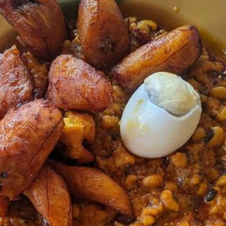 Oloyin beans porridge, plantains and boiled egg