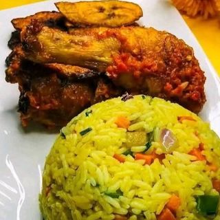 Fried Rice served with plantains and drumstick