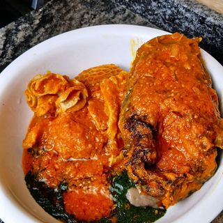 Ewedu mixed with sauced catfish pomo and shaki