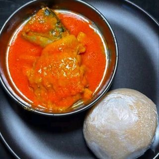 Amala served with ewedu mixed with titus fish and chicken
