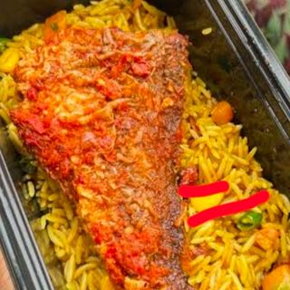 Croaker fish in peppered sauce served with fried rice
