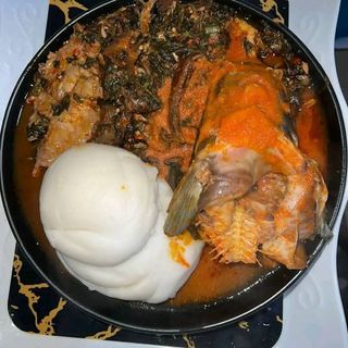 Pounded yam served with eforiro and catfish