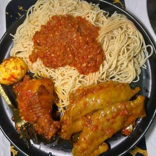 Sphaghetti, boiled egg sauce and chicken
