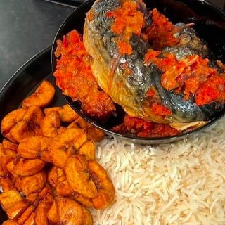 White rice and Plantains served with titus fish in spicy Nigerian sauce