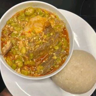 White Eba served with Okro mixed in goatmeat 