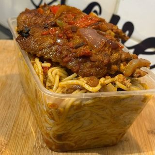 Spicy Jollof Sphaghetti served with peppered Turkey