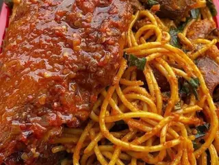 Turkey wing served with peppered Jollof Sphaghetti