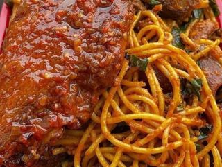 Turkey wing served with peppered Jollof Sphaghetti