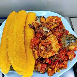 3 boiled plantains served with peppered pomo mixed with titus fish