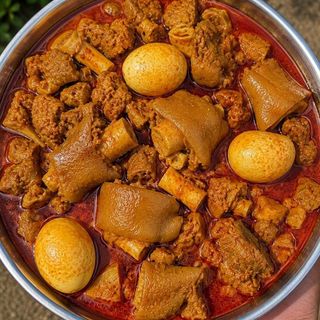 Spicy Nigerian beef stew mixed with cowlegs and 3 boiled eggs