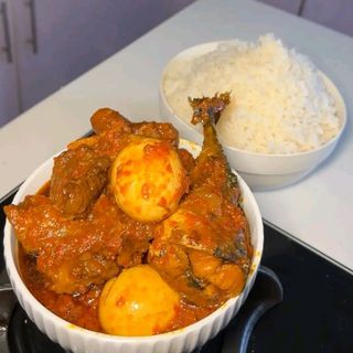 White rice served with pomo beef titus and 2 boiled eggs