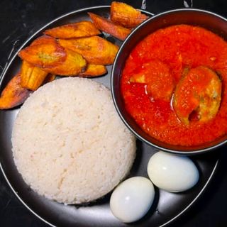White rice Plantains served with titus fish and 2 boiled eggs